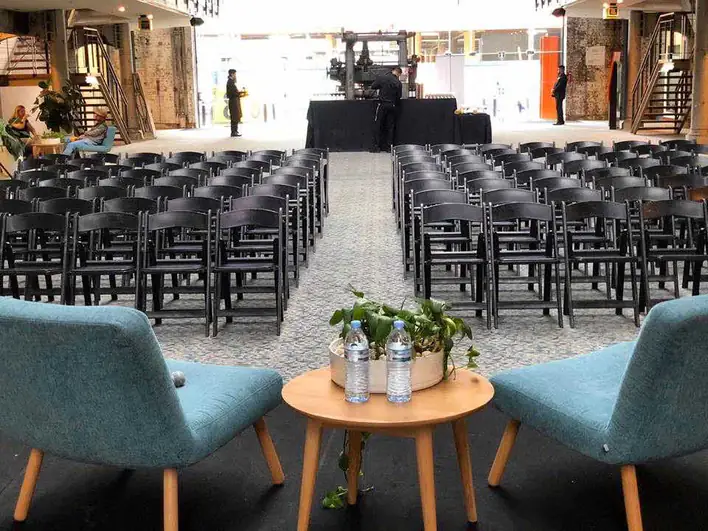 Black padded chairs for events in Belmore
