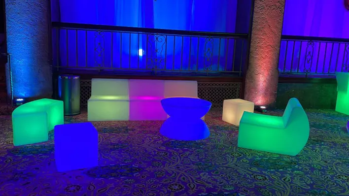A group of colorful chairs and tables in a room.