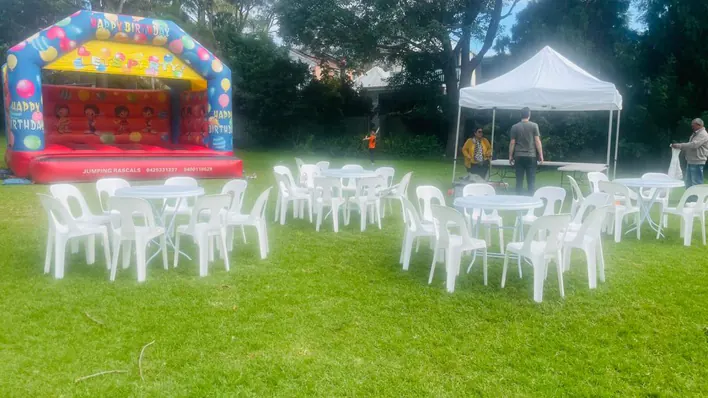 White Round Table with white plastic chairs