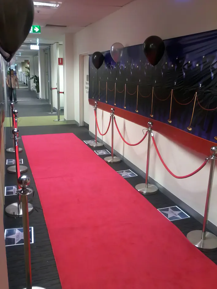 A red carpet in a hallway.