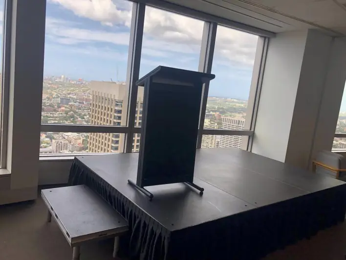 A podium in an office with a view of the city.