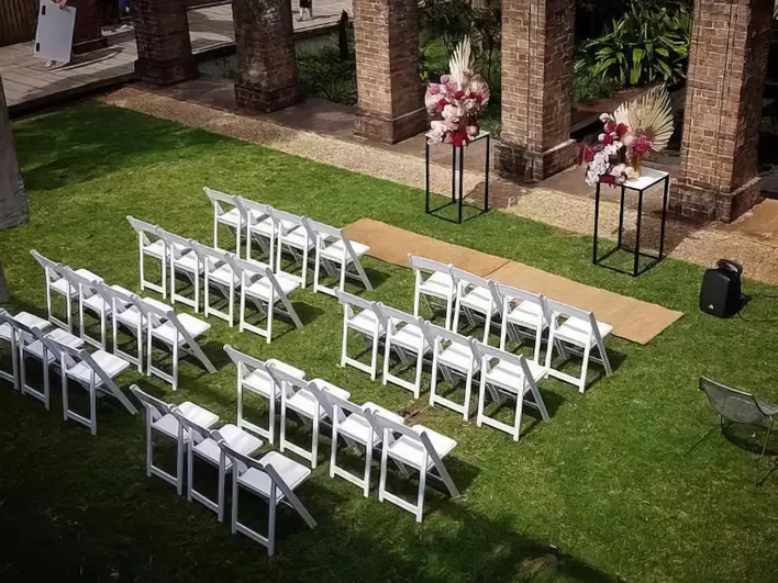 White chairs being for a wedding ceremony in Bass Hill