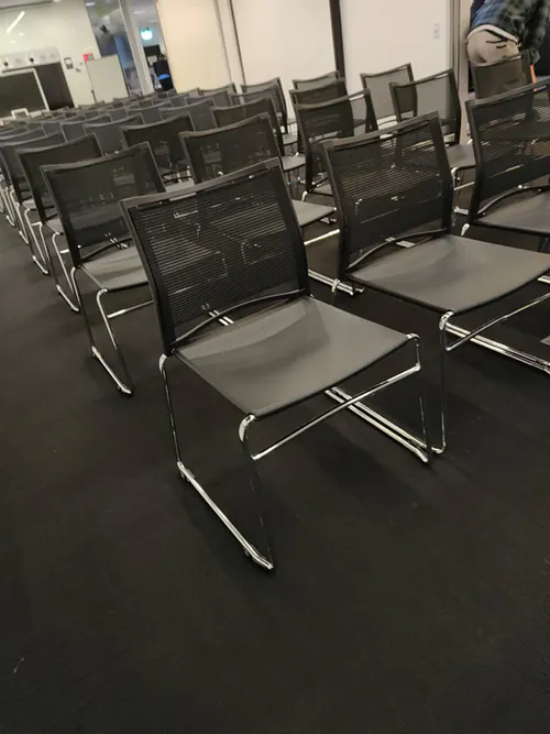 Black conference chairs lined up