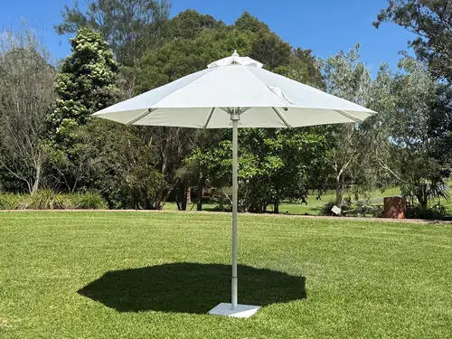 Our large white umbrella at an outdoor park