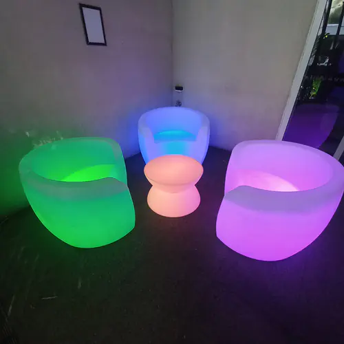 Three glow lounges surrounding a small glow table