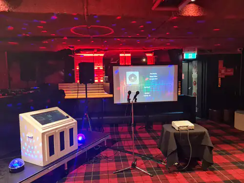 A karaoke machine and PA set-up ready for use at a party