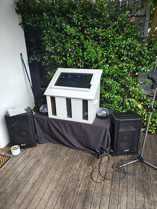 A karaoke machine ready for use at an outdoor party