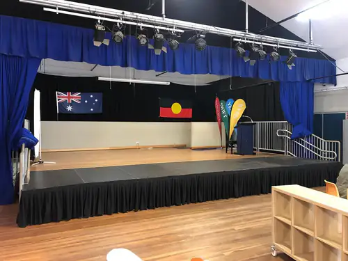 Compact stage platform with black skirting suitable for small presentations or functions