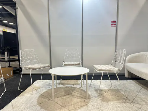 Our white wire chairs with a white coffee table