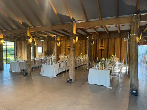 Victorian-style ghost chairs and tables set up for an indoor cabin