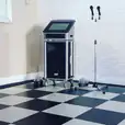 A black and white checkered floor with a karaoke machine available for hire.