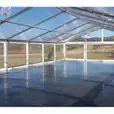 A 6m x 36m large tent with a glass floor and chandeliers.