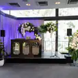 A DIY Party room beautifully decorated with flowers and plants.