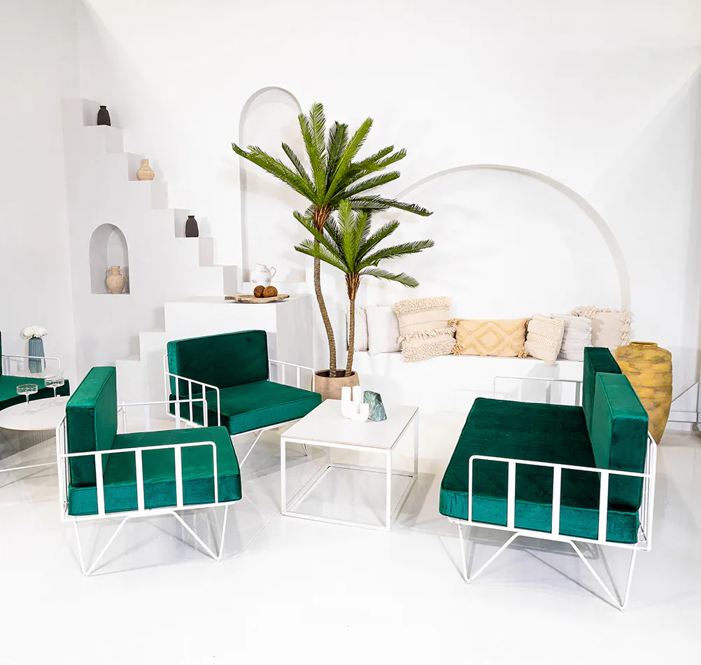 A stylish wire armchair lounge with velvet cushions