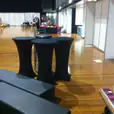 A black table and chairs in a room.