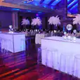 A party room with clear table and our ghost stools.