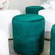 Close-up of the green velvet ottoman stool