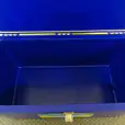 A blue plastic box, available for Esky Hire, with a lid on it.
