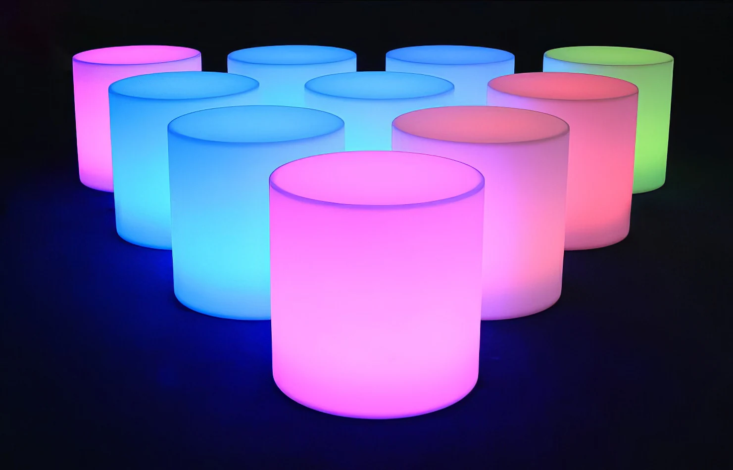 A set of colorful glow cylinders on a black background.