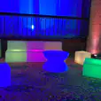 A vibrant assortment of Glow Lounge Suite Hire chairs and tables brighten up the room.