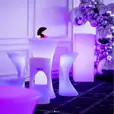 A beautiful Glow Square table and chairs set the vibrant atmosphere in a party setting.