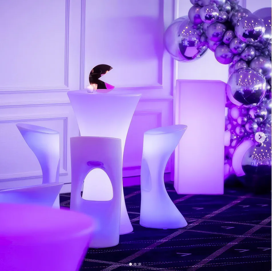 A beautiful Glow Square table and chairs set the vibrant atmosphere in a party setting.