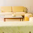 Gold coffee table and cream lounge