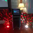 A dj set up in a room with lights, available for Jukebox Hire Only.