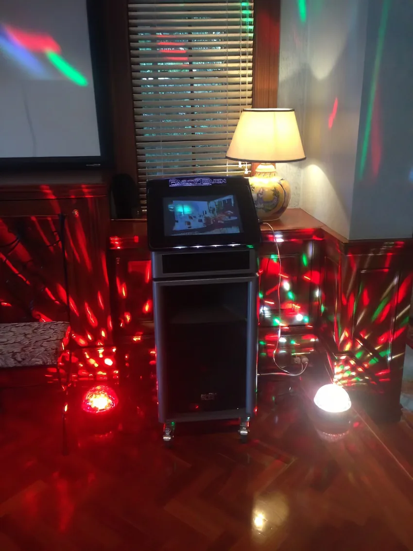 A dj set up in a room with lights, available for Jukebox Hire Only.