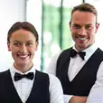 Two waitresses posing for a photo.