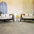 Our black rattan sofa lounge set available for hire