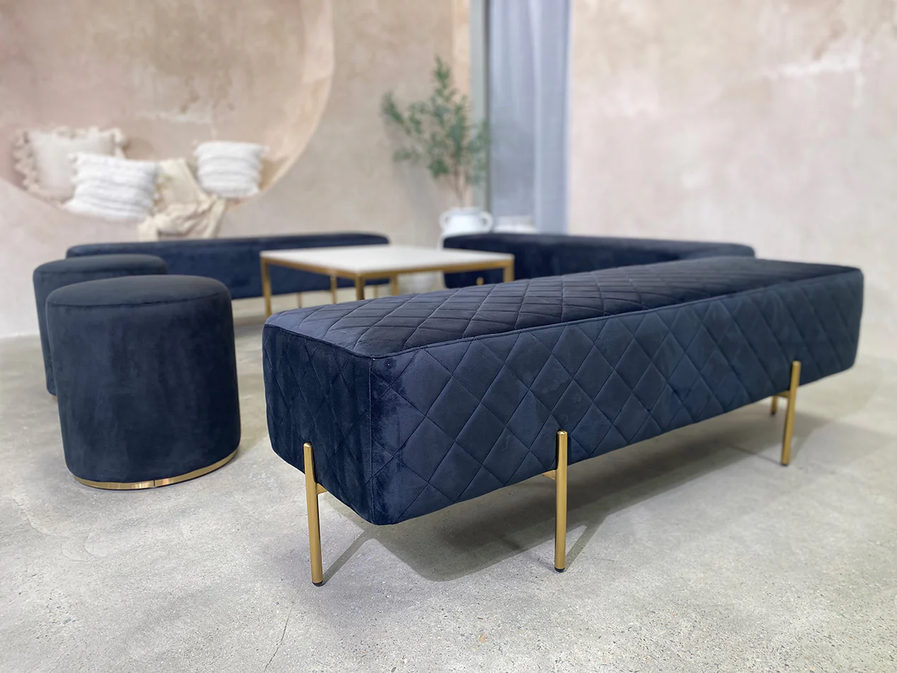 Our black velvet ottoman benches for hire
