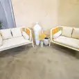 Our white rattan sofa lounge available for hire