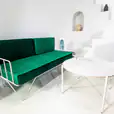 Our white wire sofa lounge with green velvet cushions available for hire