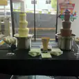 Package 3 includes a table with a chocolate fountain set up in front of it.