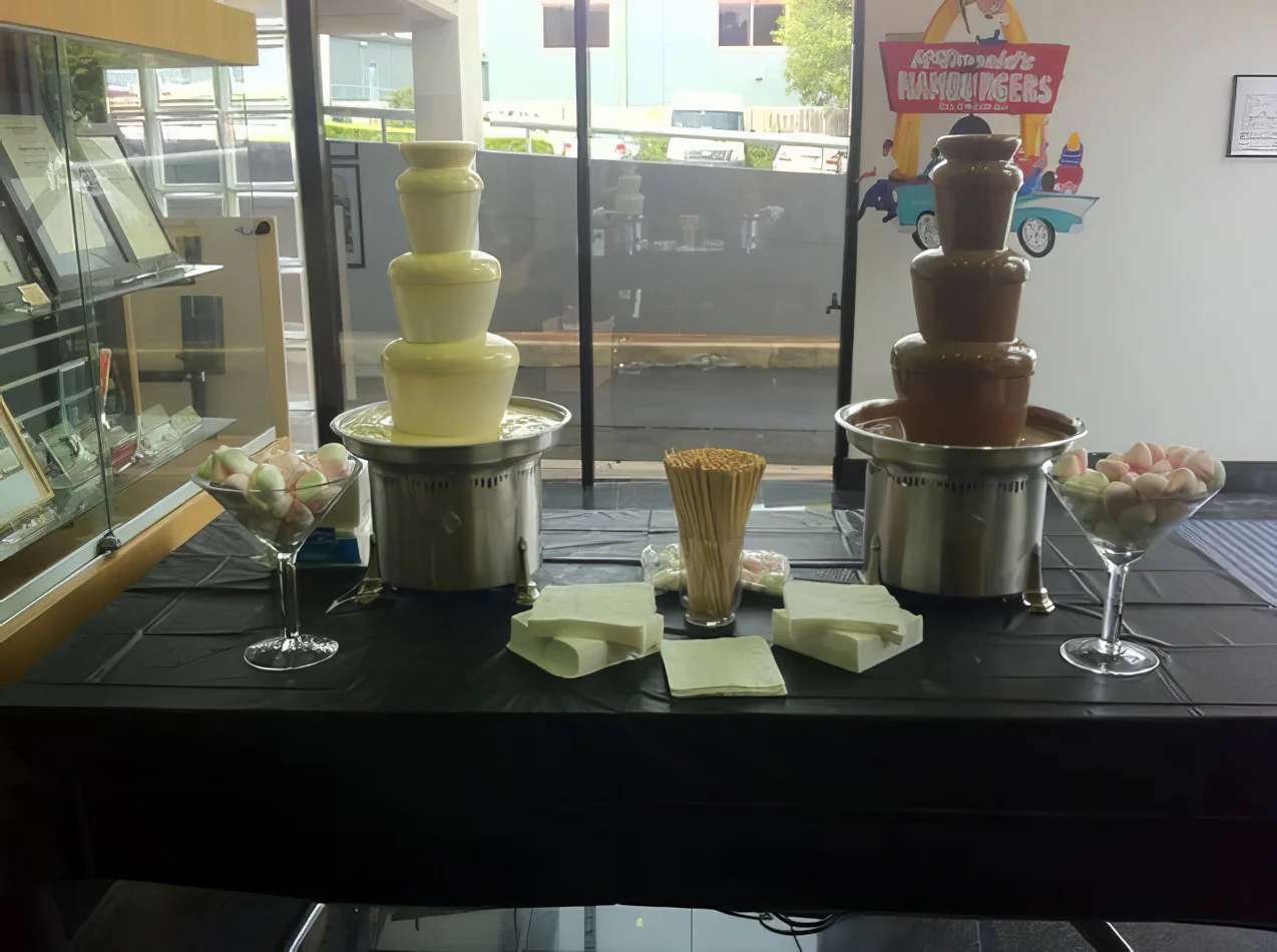 Package 3 includes a table with a chocolate fountain set up in front of it.