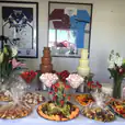 Package 5 includes a table full of food and desserts with the addition of two medium commercial fountains.