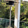 A balcony overlooking a forest with 6 x Mushroom Heaters, complete with Gas Bottles.