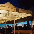 Sydney harbour bridge and sydney opera house at dusk covered by a 4mx8m Pop Up Marquee with a White Roof.