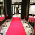 A 3m red carpet leading into a building.