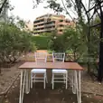 Rent a signing table for your garden event. Choose from our selection of two white chairs and a table to create an elegant atmosphere in your outdoor space.