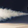 A projector with smoke coming out of it, available for Smoke Machine Hire.