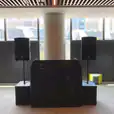 Speaker Hire: Transform any event or gathering with a large room equipped with two speakers strategically placed in front of a magnificent window.
