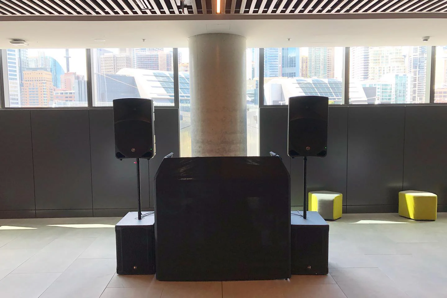 Speaker Hire: Transform any event or gathering with a large room equipped with two speakers strategically placed in front of a magnificent window.
