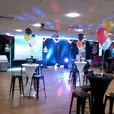 A party room with tables and our white Lycra socks