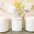 White ottoman stools set up for a party