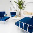 White wire lounge chairs with blue velvet cushions