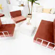 White wire sofa lounge with pink cushions