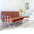 White wire sofa lounge with pink velvet cushions