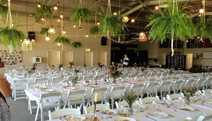 Outdoor wedding reception with simple styling and seating arrangement